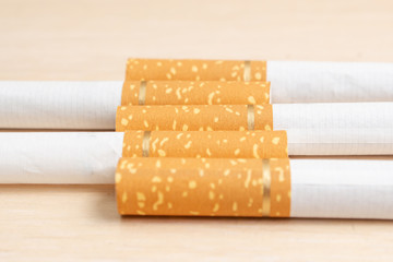 cigarette filters from orange cigarettes with a gold ribbon