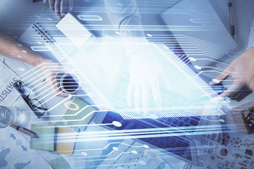 Double exposure of man and woman working together and data theme hologram drawing. Computer background. Top View.