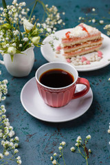 Victoria sponge cake slices with a cup of coffee on light background,top view