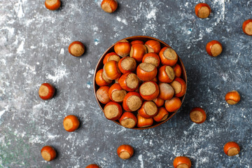 Hazelnuts on concrete background,top view