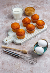 Cupcake baking background with kitchen utensils.