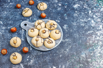 Fototapeta na wymiar Delicious cookies with hazelnuts,top view