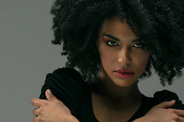 Beautiful afro woman posing in studio.