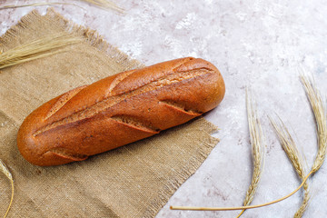 Different kinds of fresh bread as background, top view