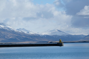 レイキャビクの港の灯台。lighthouse with a beautiful view at Reykjavik harbor, Iceland