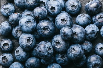 Fresh blueberry background. Texture blueberry berries close up. Vegan and vegetarian concept.