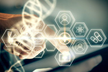 Double exposure of man's hands holding and using a phone and DNA drawing. Medical education concept.