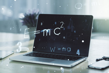 Creative scientific formula concept on modern laptop background. Multiexposure