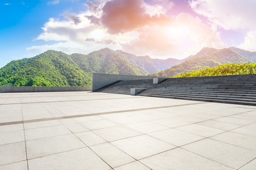 Empty square floor and green tea mountain nature landscape at sunset.