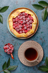 Open pie, raspberry galette. Summer berry dessert.