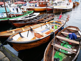 Fototapeta na wymiar Wooden boats in Bergen harbour - Norway