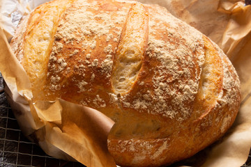Delicious italian bread on wooden table. Rustic concept.