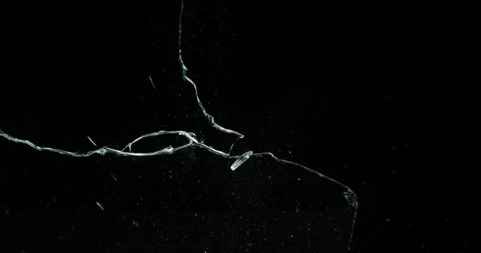 Broken cracks glass fracture effect texture isolated abstract black background. Bullet cracked window with big hole screen mirror weapon shot.