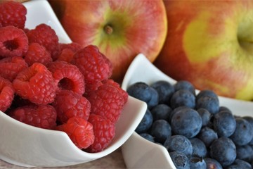raspberries blueberries and apples close-up