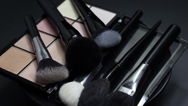 Rotating professional makeup eyeshadow palette, close up