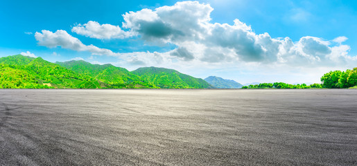 Race track road and green tea mountain on a sunny day,panoramic view.