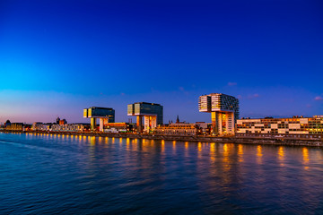 Panorama of night view of Cologne in Germany, beautiful cityscape by the Rhine at sunset 