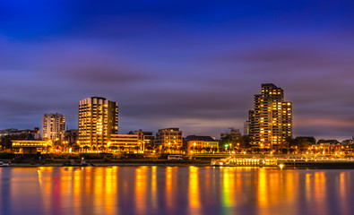 Obraz na płótnie Canvas Beatiful night view of Cologne in Germany; the illuminated Rhine and buildings in the night sky