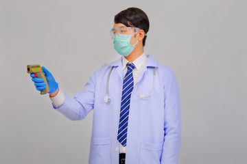 Medical doctor in white uniform doctor wears medical gloves, medical masks and and wearing...