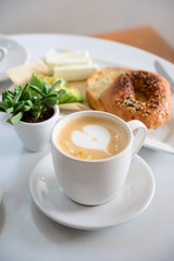 Cafe Latte table set with breakfast and green plant