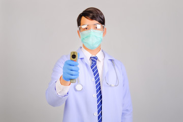Medical doctor in white uniform doctor wears medical gloves, medical masks and and wearing...