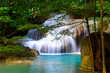 Waterfall the Erawan Waterfall idyllic in green forest
