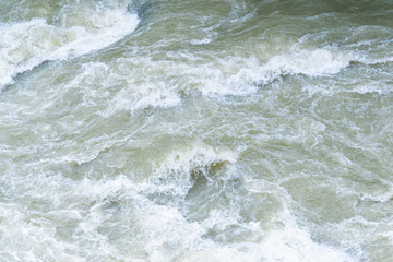Fototapeta premium rushing water of fast flowing river, storm waves of ocean, sea surf