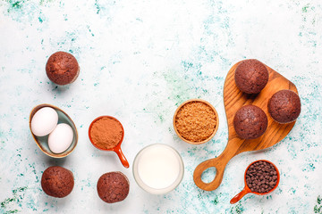 Cupcake baking background with kitchen utensils.