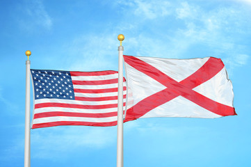 United States and Northern Ireland two flags on flagpoles and blue cloudy sky
