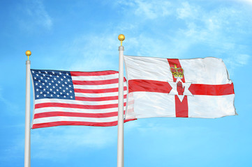 United States and Northern Ireland two flags on flagpoles and blue cloudy sky