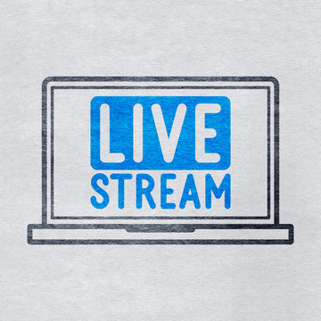 Live stream icon and laptop on grey paper background
