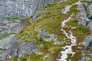 mountain trail to rock top and cliff, hiking and mountaineering on mountain ridge, symbolizes path to success, perseverance in achieving goals