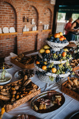 A table full of fresh arranged fruit for a party