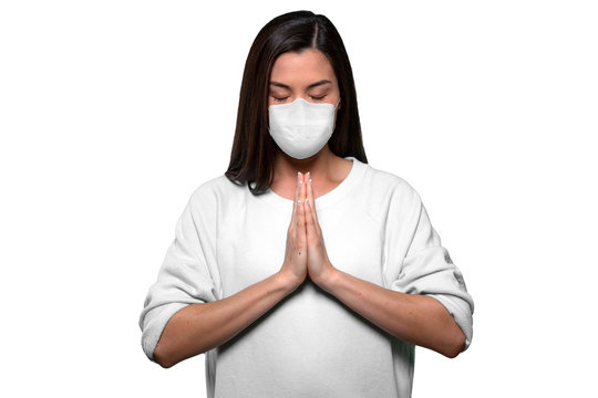 Asian american woman staying calm and finding peace through prayer and meditation during pandemic crisis