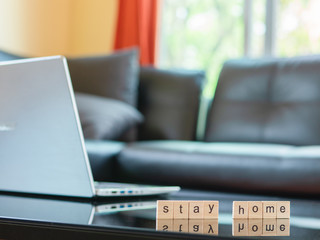 Computer laptop on the table in living room. Stay home, work from home and social distancing.