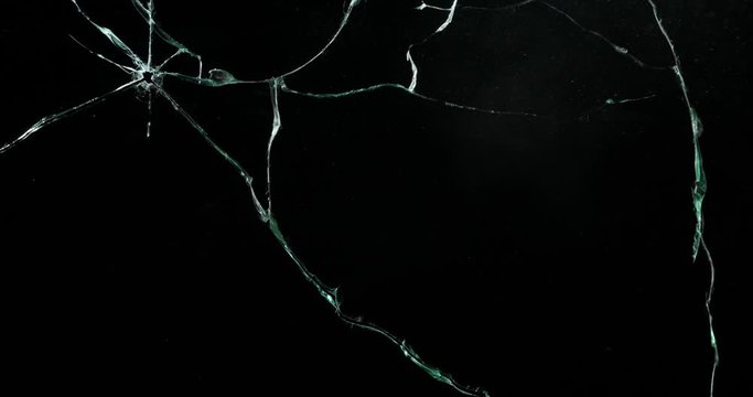 Broken cracks glass fracture effect texture isolated abstract black background. Bullet cracked window with big hole screen mirror weapon shot.