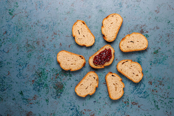 Fototapeta na wymiar Bread slices with raspberry jam,easy healthy snack,top view
