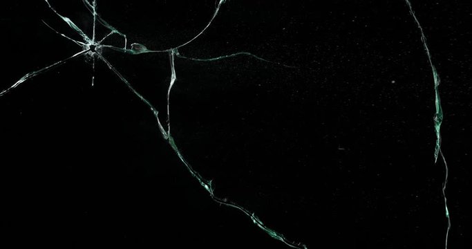 Broken cracks glass fracture effect texture isolated abstract black background. Bullet cracked window with big hole screen mirror weapon shot.