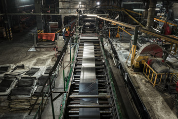 Interior of a factory for manufacturing rubber conveyor belts.