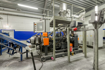 Interior of a factory for manufacturing rubber conveyor belts.