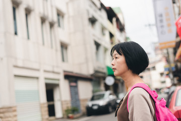 walking Asian traveling woman