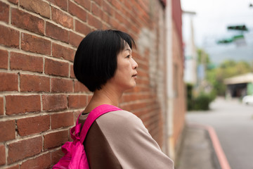 Asian traveling woman with bag