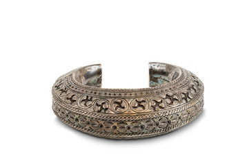 Thai style ancient handcrafted silver bracelet on white background with clipping path.