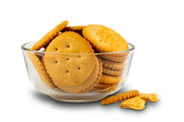 Pile of freshly baked crunchy crackers in a glass bowl on white background with clipping path.
