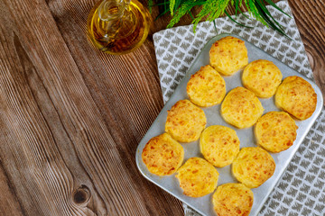 Brazilian cheese bread in baking pan with oil.