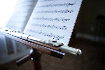 flute on music stand with sheet music