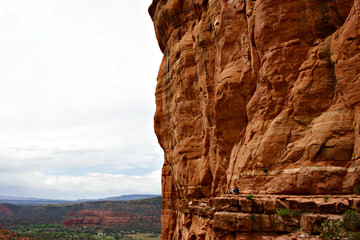 Hikers overlooking view from Cathedral Rock trail in Sedona Arizona