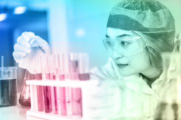 Asian Scientist Pipetting at a Biomedical Laboratory.Focused young life science professional...