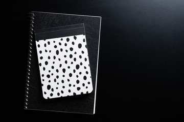 Black style set: notepad on Black background.