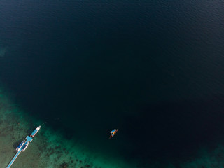 small boat and clear sea